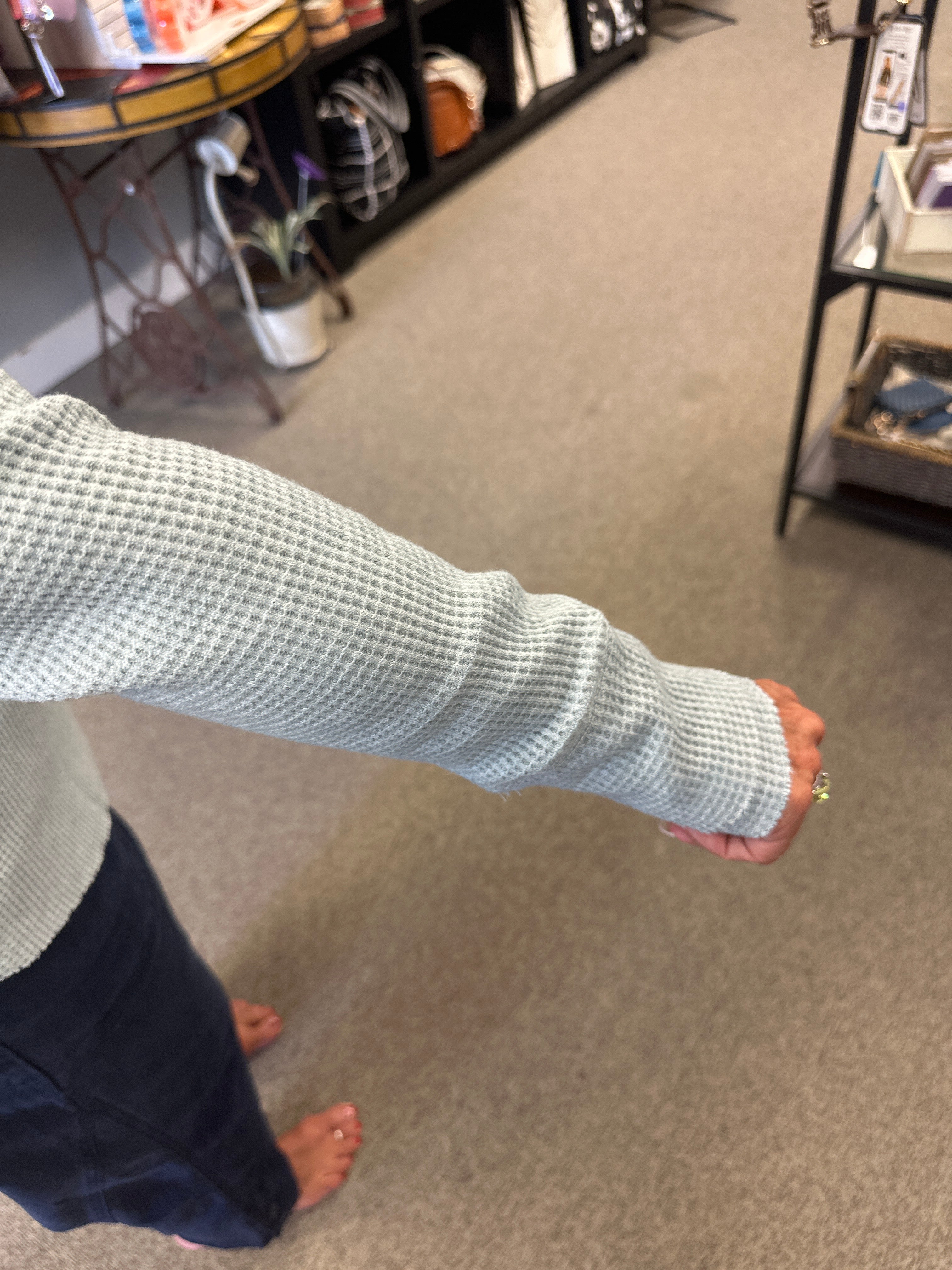 Person with a cast on their arm in an indoor setting